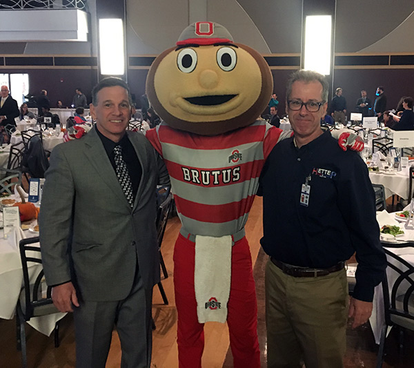 Pictured are John Hetterscheidt (left) with Hetter sales rep & brother Rick Hetterscheidt (right) along with Brutus Buckeye at the 2016 Awards ceremony at the Ohio Union.